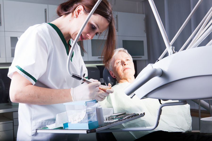 bigstock-Professional-woman-dentist-doc-83170277.jpg